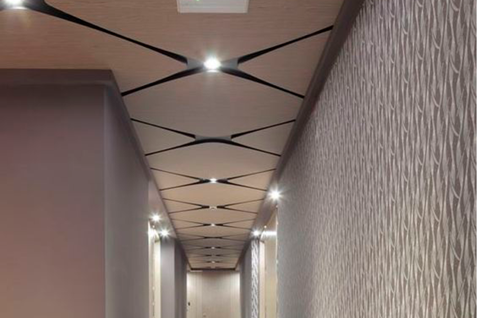 When it comes to choosing materials for the ceiling, wood is definitely a timeless choice. Wood gives any room a warm and inviting look, making it a popular choice for people who want a cozy and comfortable atmosphere. There are different types of wood that you can use for your ceiling, each with its unique aesthetic appeal. Some popular choices include oak, pine, cedar, and mahogany. Oak is robust and has a striking grain pattern, while Pine is lightweight with an attractive knotting pattern. Cedar, on the other hand, has a natural aroma that repels insects, making it an excellent choice for outdoor ceilings. Lastly, Mahogany has a rich, deep red color that adds an elegant look to any ceiling. One of the advantages of using wood for your ceiling is the striking beauty it adds to your space. Wood gives your room a natural and inviting atmosphere that is unmatched by any other material. Additionally, the durability of most wood types ensures the ceiling lasts for decades. However, there are some downsides to using wood. The cost is relatively higher than most materials. Wood is susceptible to moisture, so the ceiling may warp or rot if exposed to moisture for a long period. Additionally, if not adequately treated, the wood could be home to insects like termites. Despite the downsides, wood remains a favorite material for ceilings, and with good reason. With proper maintenance and attention, it can last a lifetime and give your room a warm and welcoming feel. So if you're looking to add a touch of nature to your ceiling, wood is an excellent option to consider.