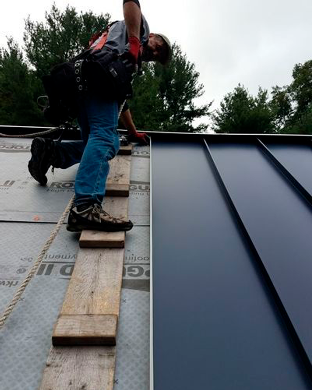 Another benefit of metal roofing is that it requires minimal maintenance. Unlike other materials like asphalt shingles that need frequent repair and replacement, metal roofing can last up to 50 years without needing much attention. So, you can forget about costly repairs and enjoy peace of mind knowing your roof is in good shape.