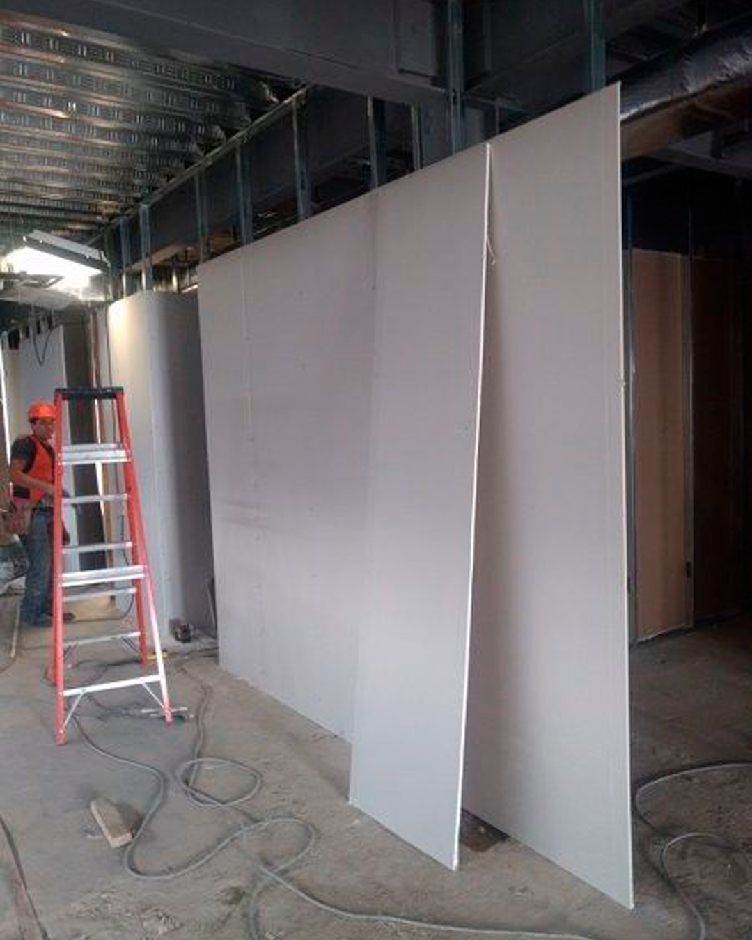 Drywall is an essential component of home construction in America. There are different types of Drywall materials that serve different purposes. Gypsum board is the most common drywall material, made of gypsum plaster and a paper facing. It is fire-resistant and relatively cheap.